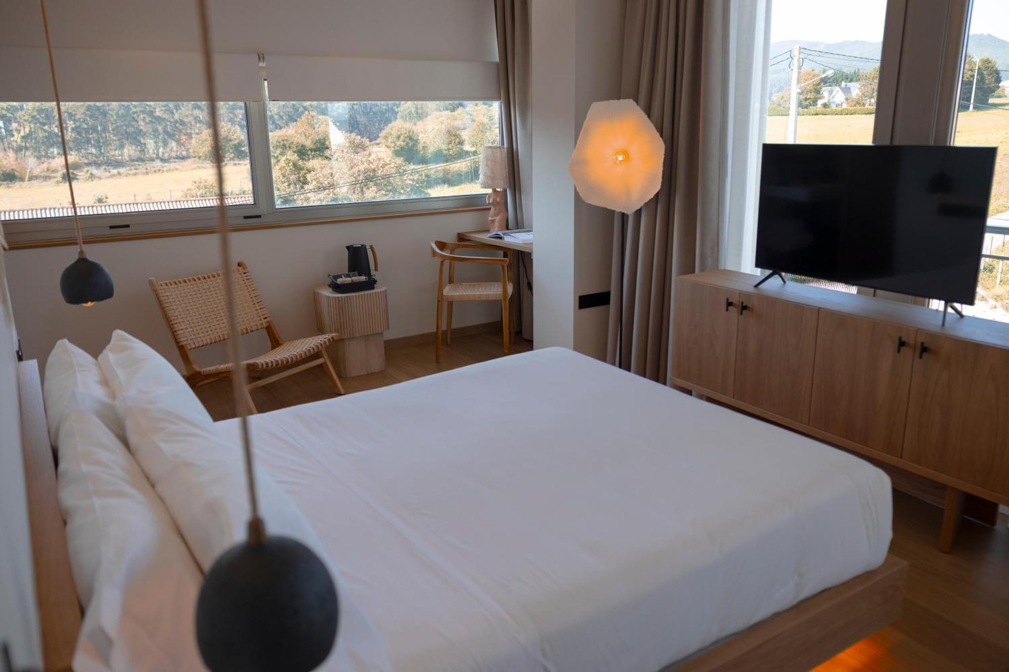 Habitación Doble Deluxe con vistas laterales al mar